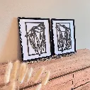 A00441-geometrisches-zwei-woelfe-holz-schwarz-wanddekoration-modern-im-bilderrahmen.webp