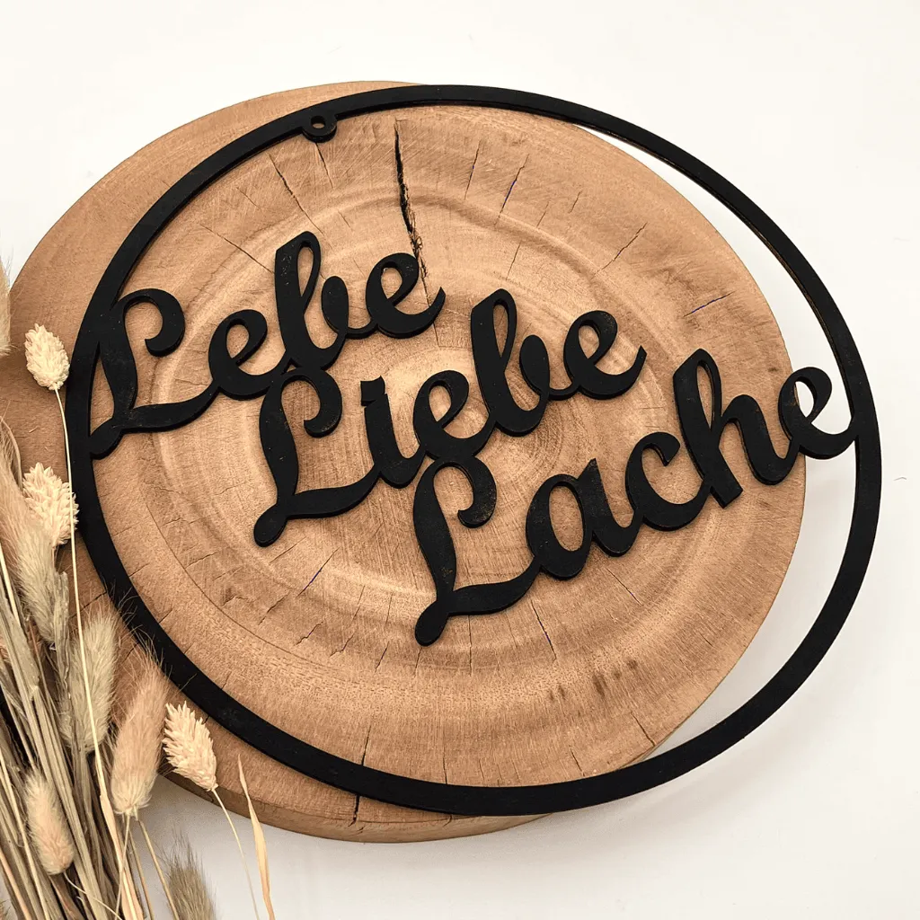 A00435-holz-schwarz-wanddeko-lebe-liebe-lache-rund-modern-seitlich.webp